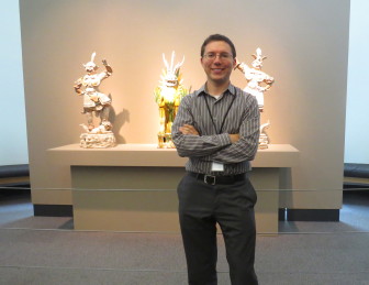 Dr. Kspeka posing in front of one of Bruce's exhibits. 