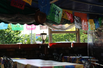 The outdoor seating at Coyote Flaco (you can see the sombrero hanging in the back!). Credit: Leslie Yager