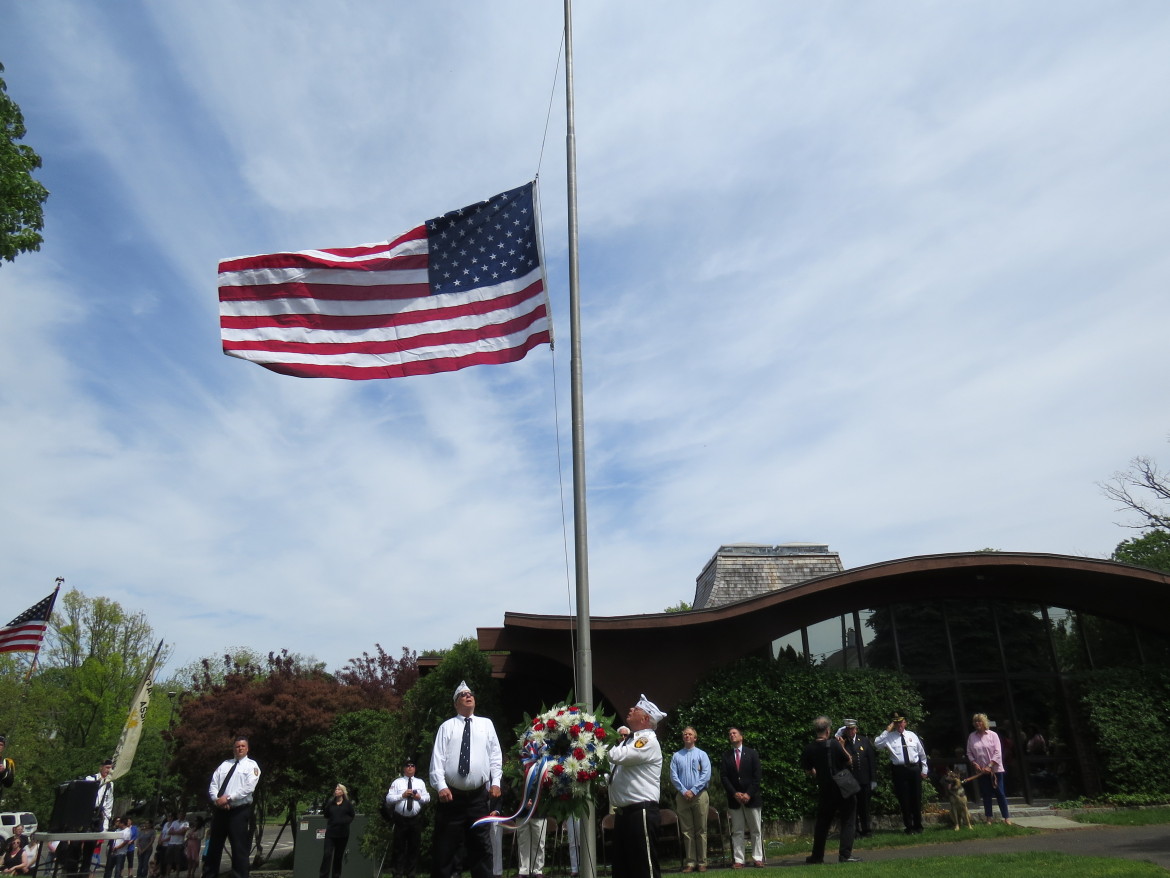 The raising of the flag at Byram Schubert Library. credit: Kailee Donnelly 