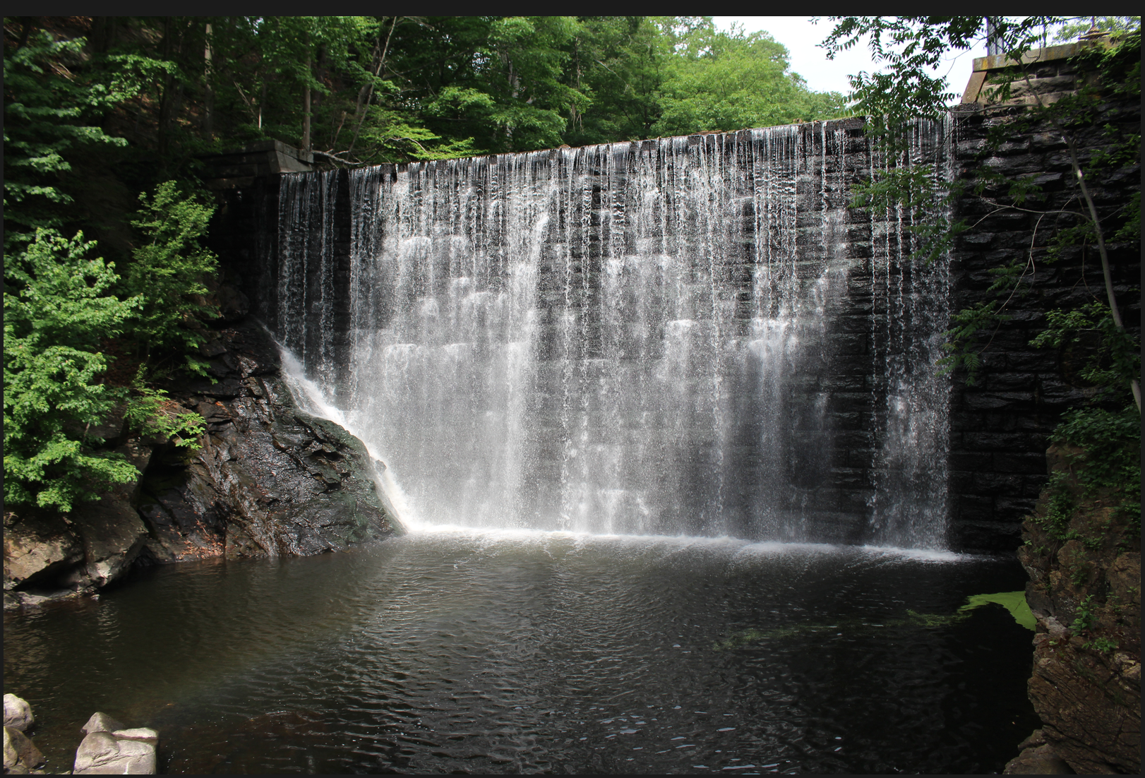 dam on the Byram River, reinforced with granite.