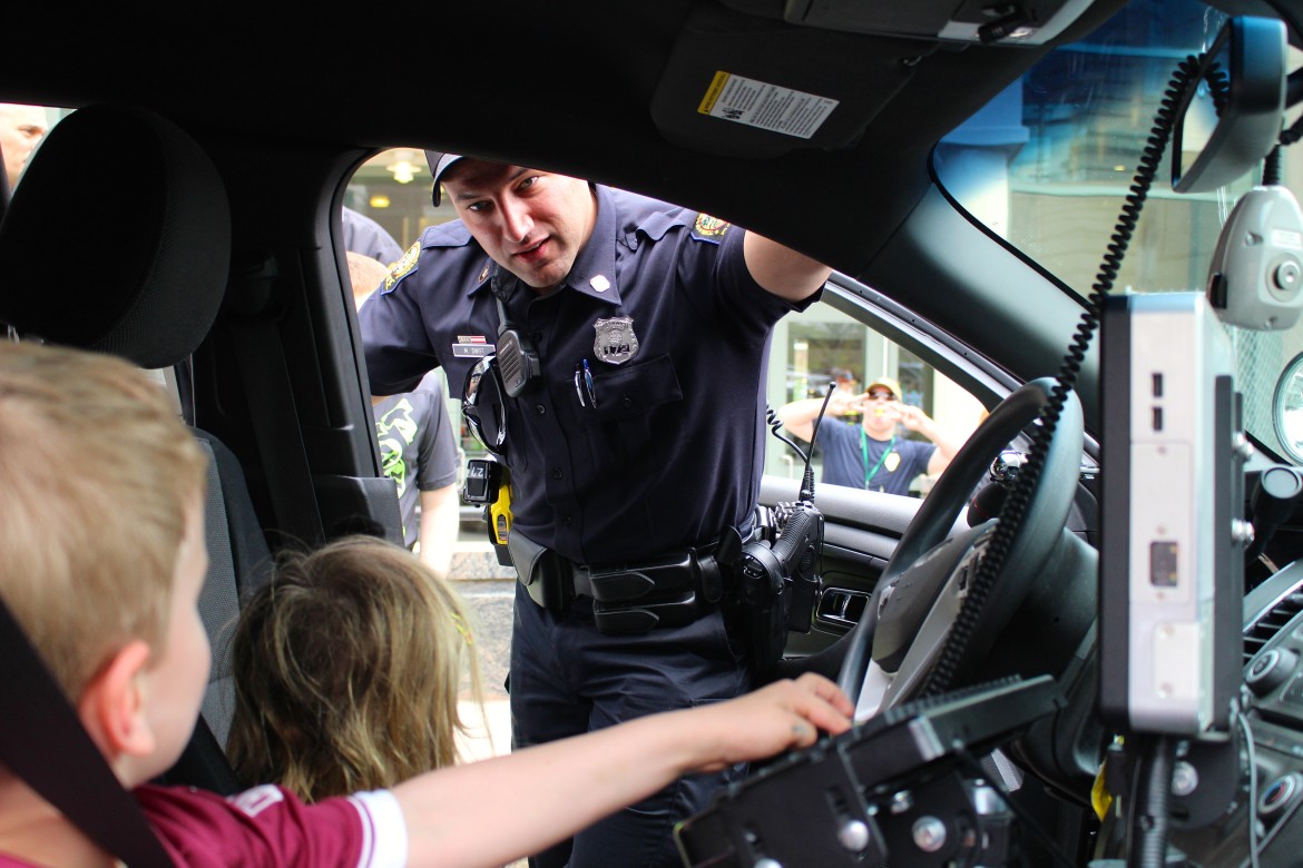 police day:kids in police car