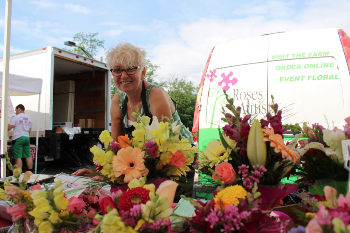 Debbie Steele at her Roses for Autism flower stall at the Greenwich Farmers Market, July 2015 Photo: Leslie Yager