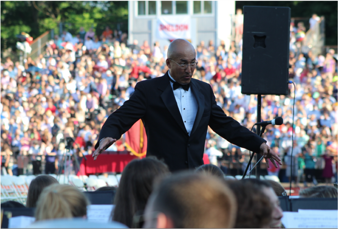 Mr. John Yoon leads the band at graduation in June 2014. Credit: Leslie Yager