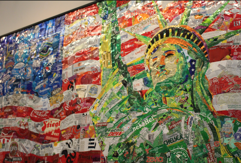 The American Flag Made of Various Aluminum Cans and Wrappers. Credit: Emma Daley.