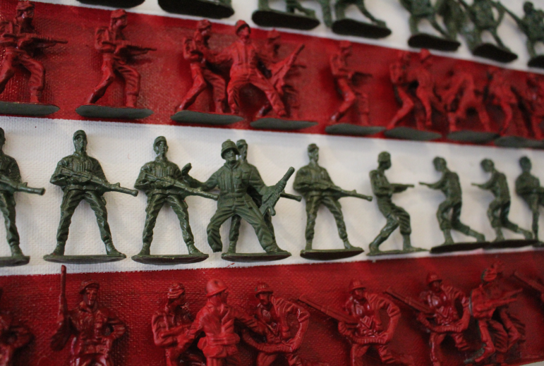 Red and White Stripes Composed of Toy Army Men. Credit: Emma Daley.