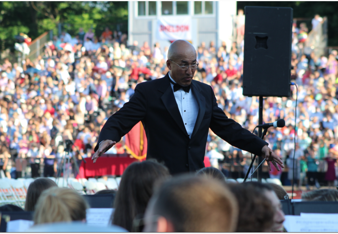John Yoon conducting the band at Graduation at Greenwich High School 2014
