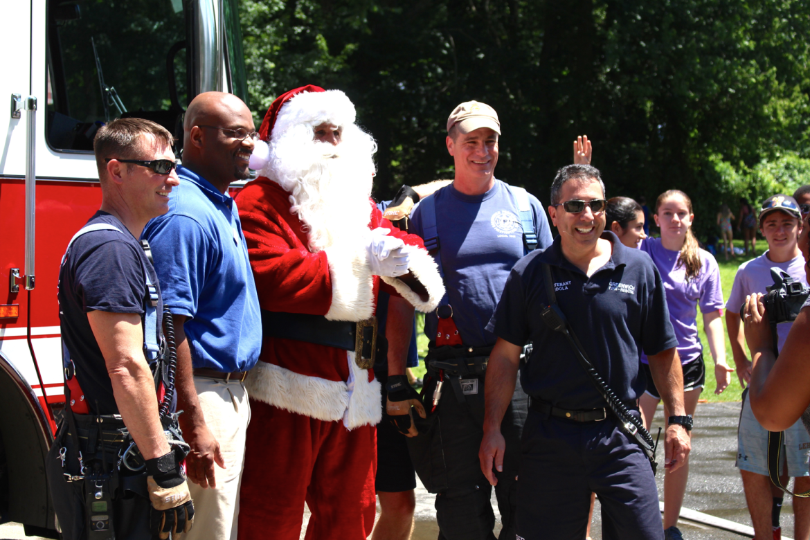Over 200 campers, CITs and Camp Simmons staff enjoyed a day of holiday themed festivities, punctuated by a visit from Santa Claus who arrived on a fire truck. Credit: Leslie Yager