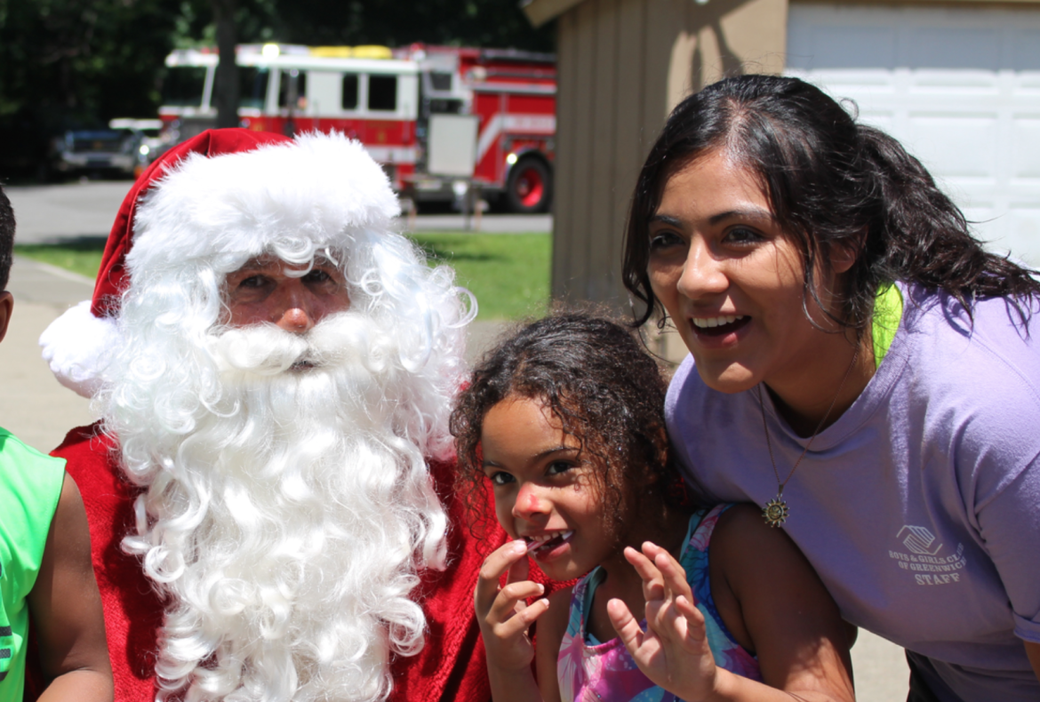 Over 200 campers, CITs and Camp Simmons staff enjoyed a day of holiday themed festivities, punctuated by a visit from Santa Claus who arrived on a fire truck. Credit: Leslie Yager