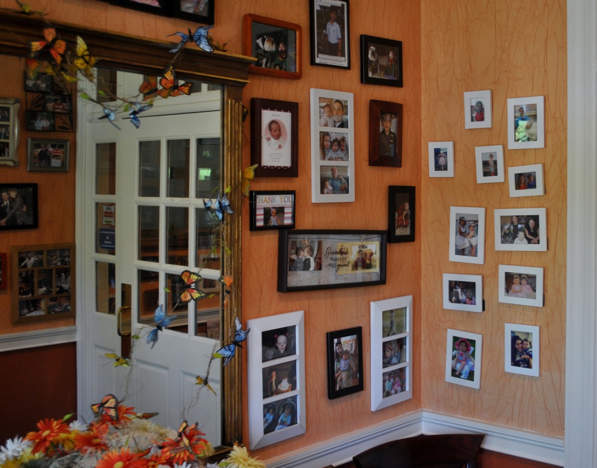 With this many pictures of friends hanging on the wall, imagine what their photo albums must be like! Credit: JC. 