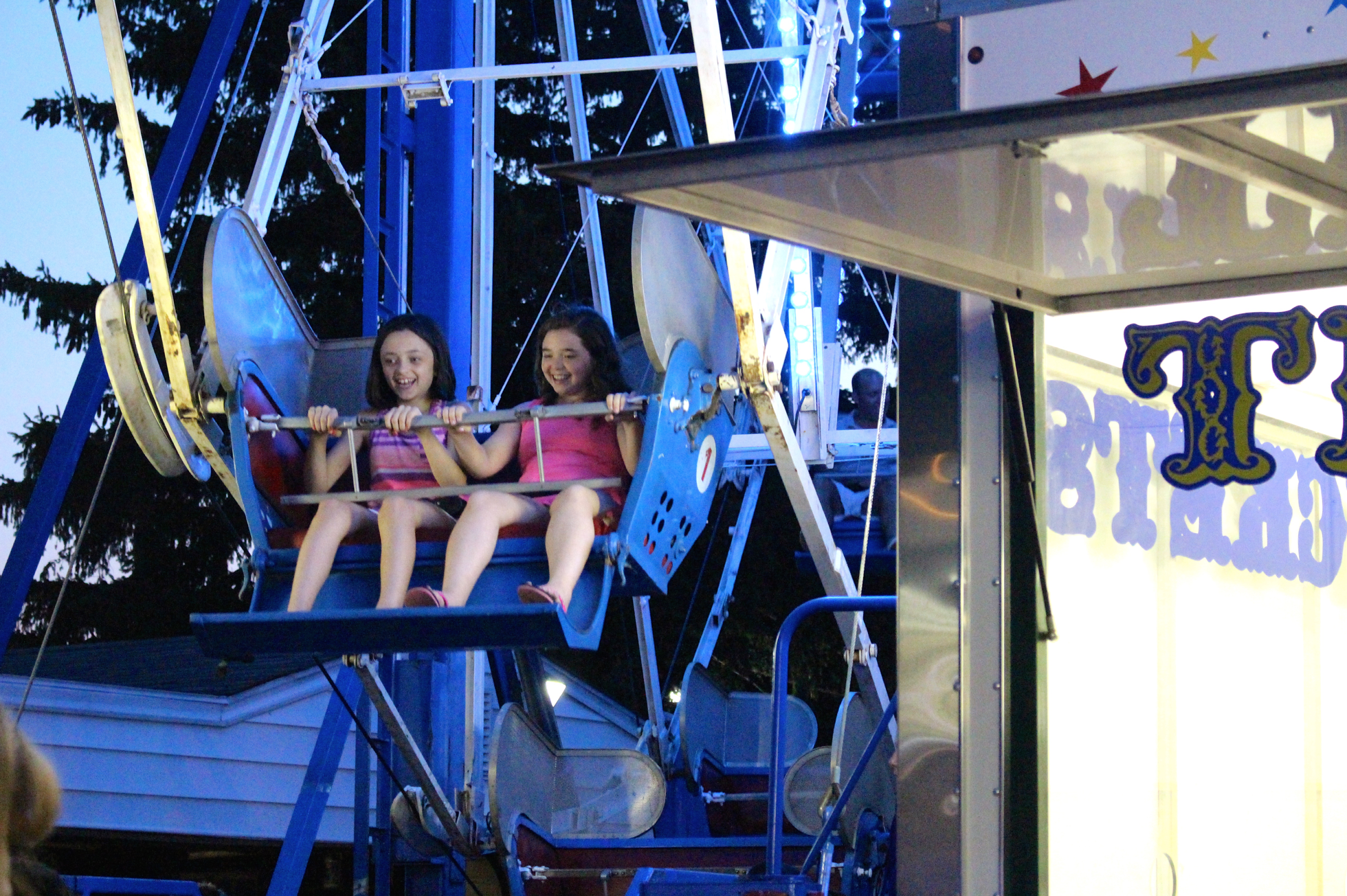 Childrens games and rides are popular at St. Roch's Feast, Friday. Aug. 14, 2015. Credit: Leslie Yager