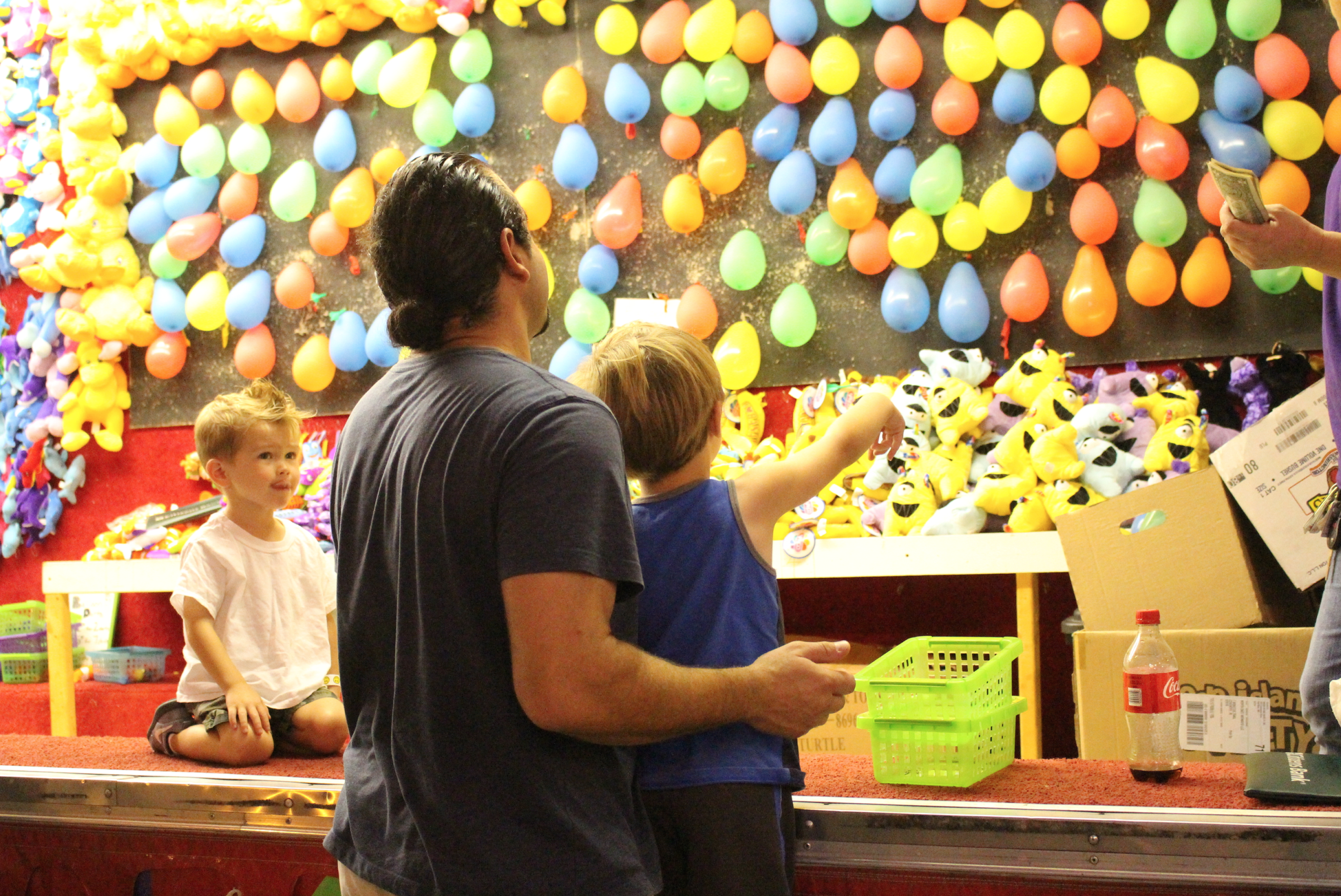 Childrens games and rides are popular at St. Roch's Feast, Friday. Aug. 14, 2015. Credit: Leslie Yager