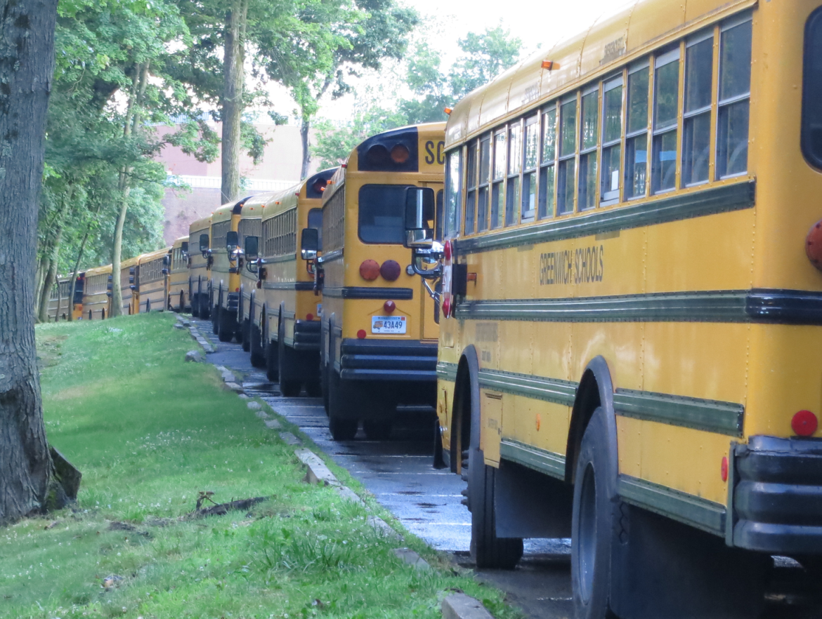 Greenwich school buses in the GHS parking lot.