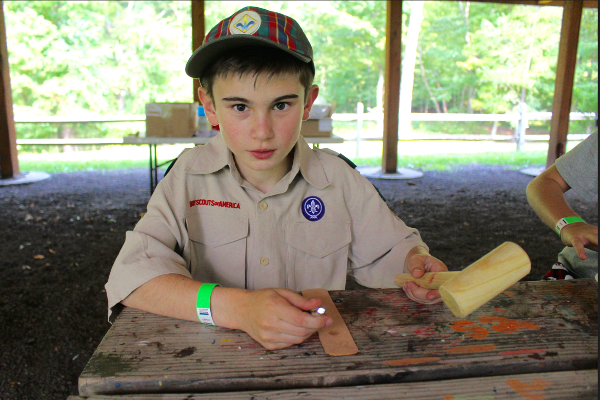 One of the stations at Cub Scout Fun day was leather bookmark making. Credit: Leslie Yager