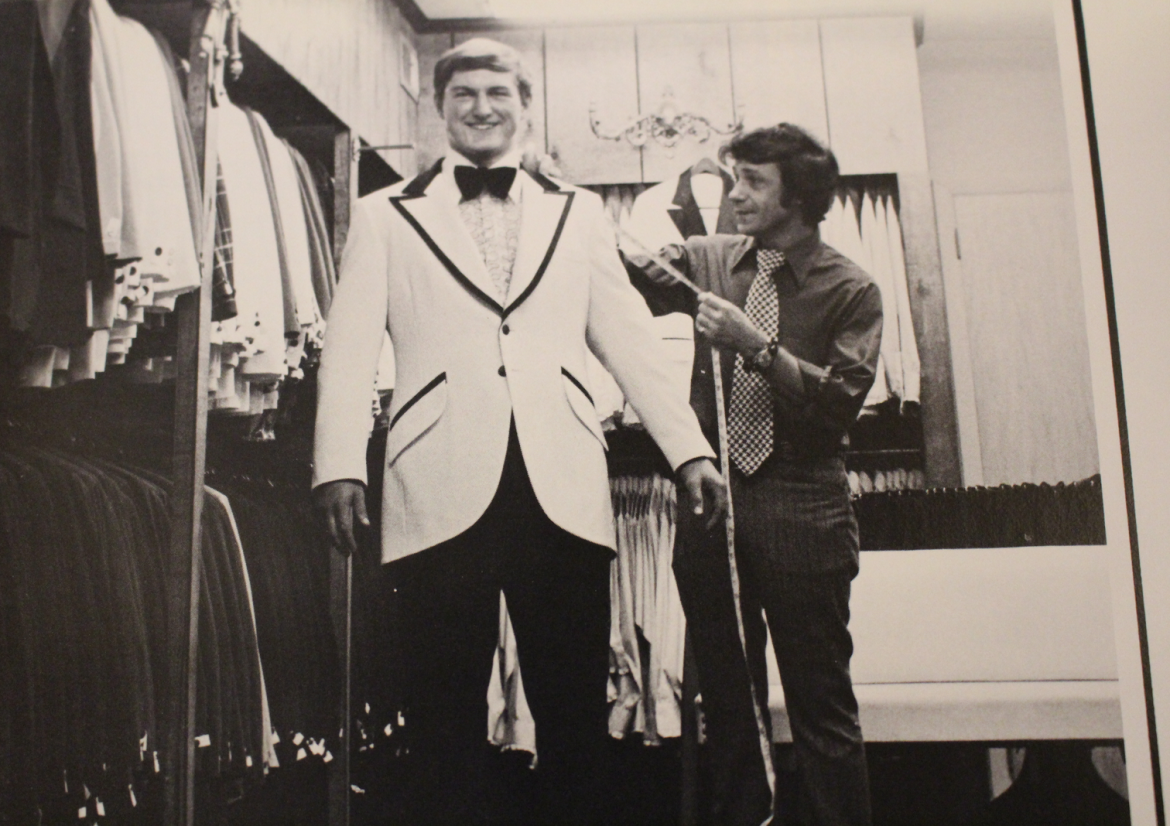 Dean Goss getting fitted for his tuxedo for prom, 1975 Compass yearbook