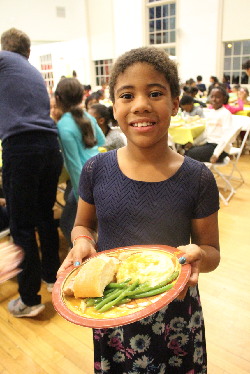  Lily Smith is ready to tuck in to her Thanksgiving meal at the Boys & Girls Club, Nov. 24, 2015. Credit: Leslie Yager