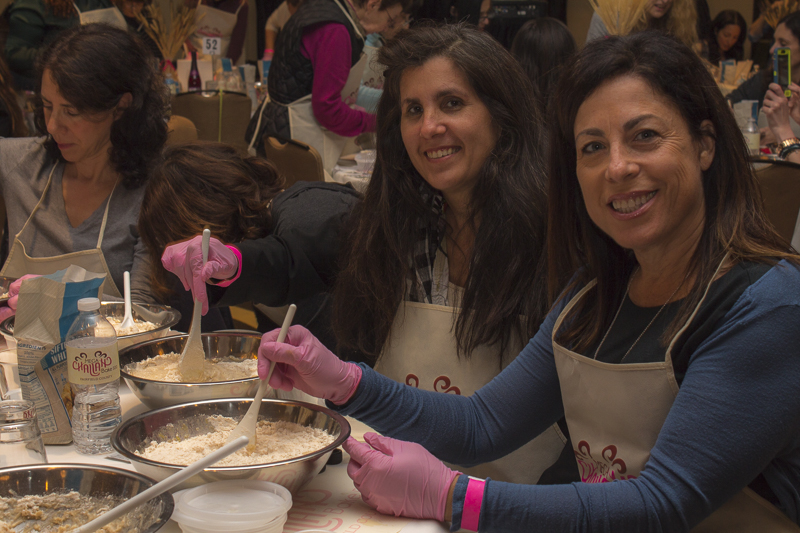 Women bonded as they stirred in the flour to create the perfect aromatic loaf. Credit: Karen Sheer