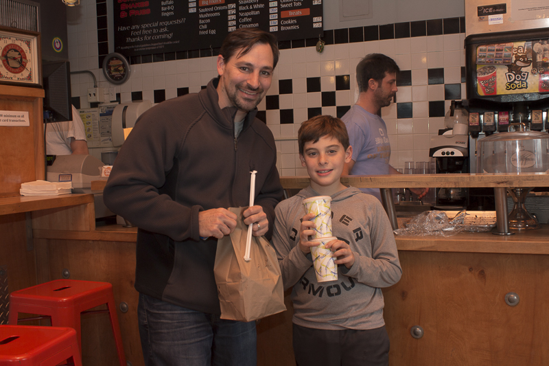 A Father and son leaving with their burgers, shakes & fries to go. Credit: Karen Sheer