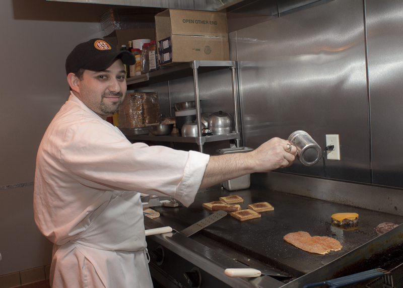 Manuel Perez, part of the team, cooks to order. Credit: Karen Sheer
