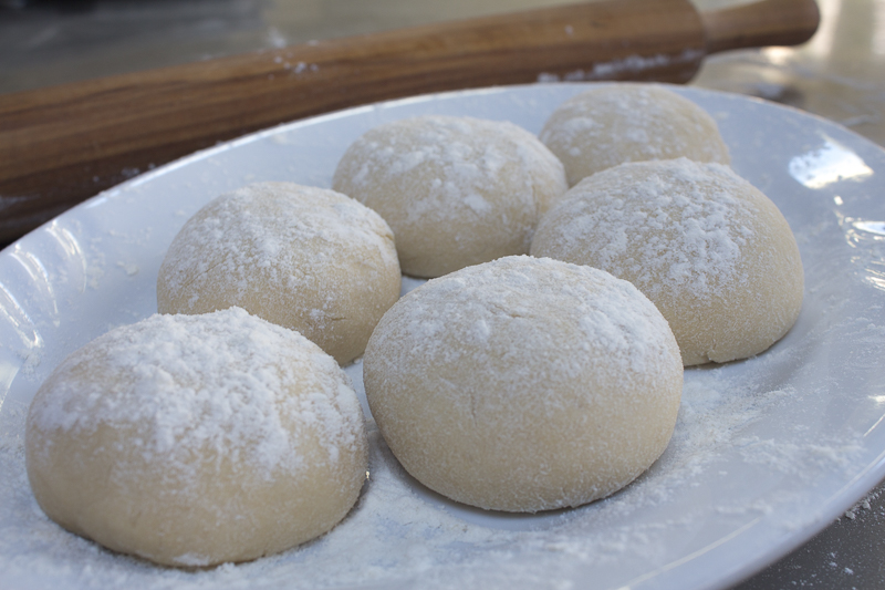 The dough portioned into six balls, quite easy once you get the hang of it. Credit: Karen Sheer