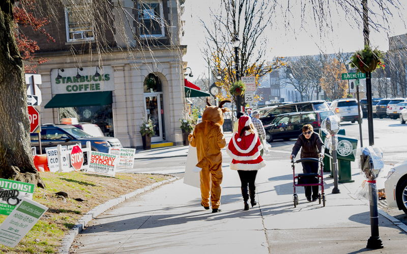 A Reindeer and Santa spotted strolling down Greenwich Avenue