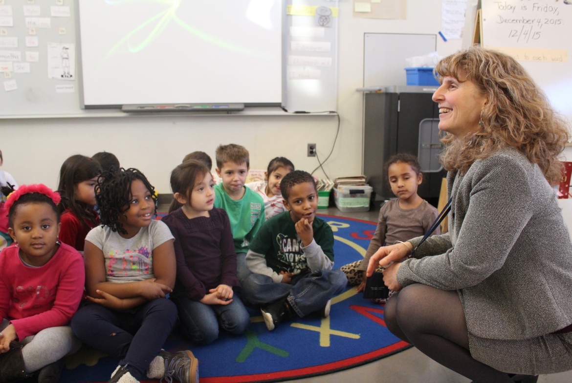 Principal Cindy Rigling with kindergartners in Mrs. Sprigg's class, Dec. 4, 2015. Credit: Leslie Yager