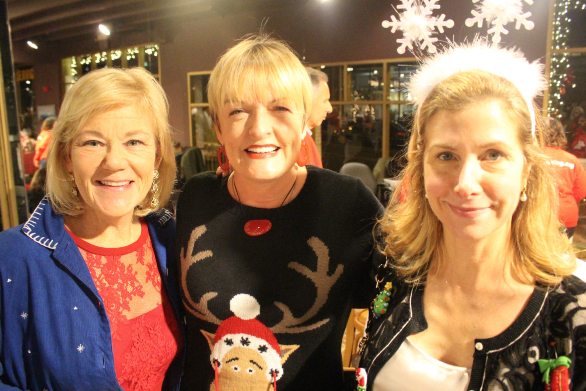 Carol Swift, Franchesca Biondo, and Lisa Wysocki at the ugly sweater party at Carriage House Motors, Dec. 12, 2015. Credit: Leslie Yager