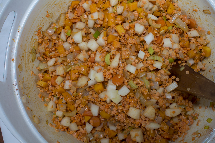 After the vegetables sauté, the red lentils and pears are added to the pot. Credit: Karen Sheer