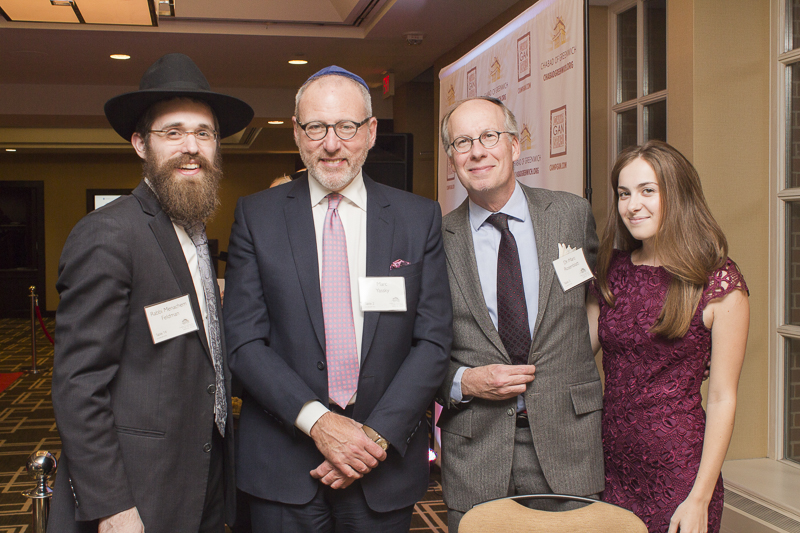 Rabbi Menachem and friends chatting and celebrating the evening. Credit: Karen Sheer