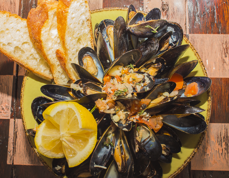 Steamed Mussels with Beer, Garlic and Shallots are plump and sweet. Credit: Karen Sheer