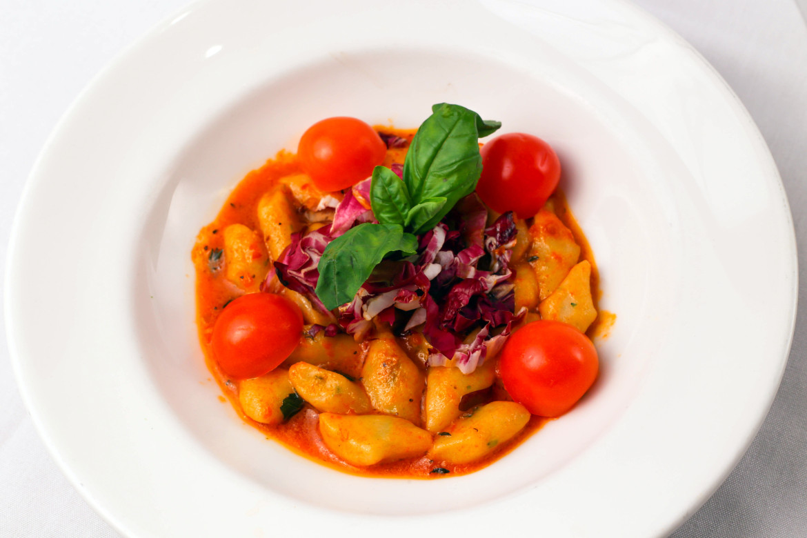 Gnocchi Alla Alba - a favorite at Alba's, with cherry tomatoes, radicchio and extra virgin olive oil. Credit: Albas