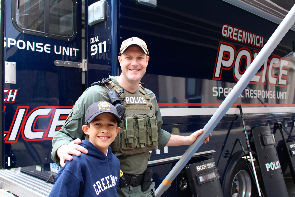 Craig Zottola, who is part of Greenwich Police Special Response Unit hit it off with Ryan Lewis, 11, who attends Eastern Middle School. Ryan’s dream is to become a Navy Seal. Credit: Leslie Yager