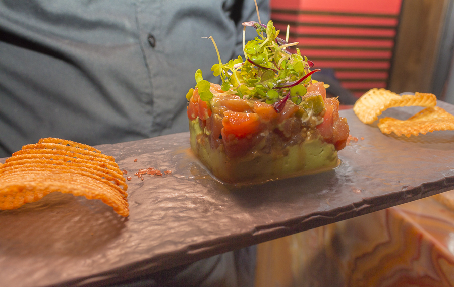 Tuna tartare is served on a base of creamy avocado with crisp, waffle-cut home made chips. Credit: Karen Sheer