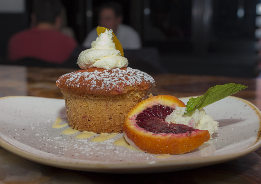 An individual sponge cake flavored with oranges and beets. Credit: Karen Sheer