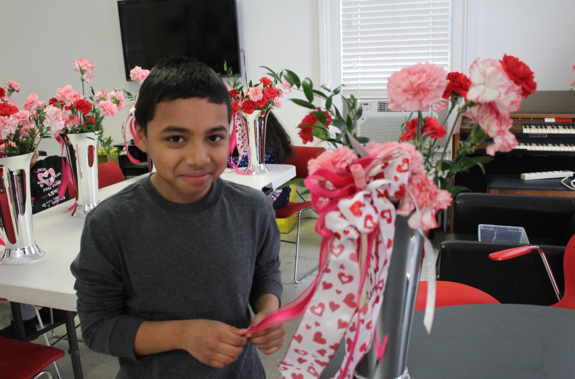  Ayden showed off the Valentine's Day flower arrangement he will bring home to his family. Feb. 12, 2016 Credit: Leslie Yager