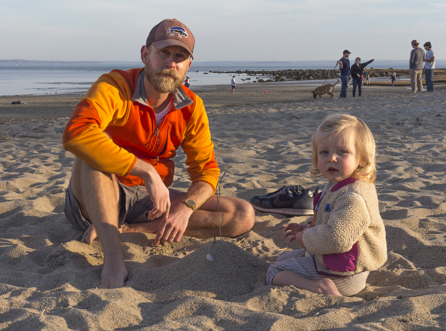Morgan Evans with his daughter Bea play in the sand. Credit: Karen Sheer
