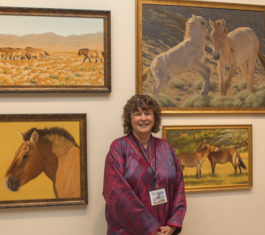 Artist Susan Fox with her stunning works of wildlife in Mongolia. Credit: Karen Sheer