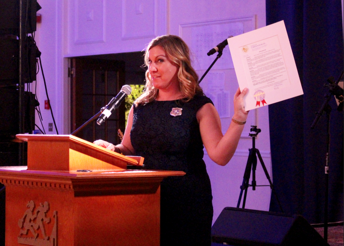 Stephanie Dunn Ashley, a member of the Cos Cob Fire Police Patrol with a Proclamation from the First Selectman naming April 23, 2016 Paul B Hicks III Day. Credit: Leslie Yager