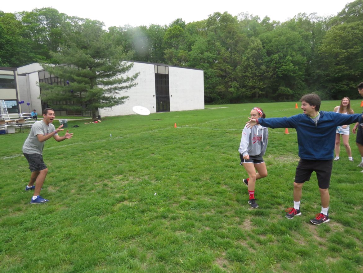 Mathew Lamanna tosses a frisbee to teammate Stephen Ali Credit: Bobby Baird