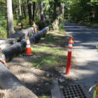 At the intersection of Farms Road and Taconic Road, an emergency overground water pipeline moves underground - Greenwich Free Press