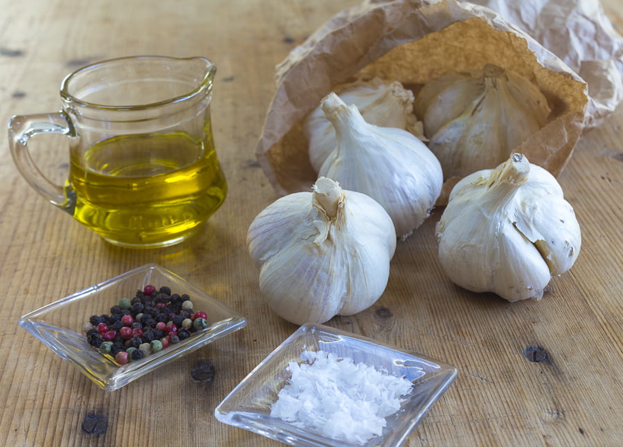 Roast three heads of garlic in the oven with olive oil, a pinch of salt and pepper and thyme sprigs. Credit: Karen Sheer