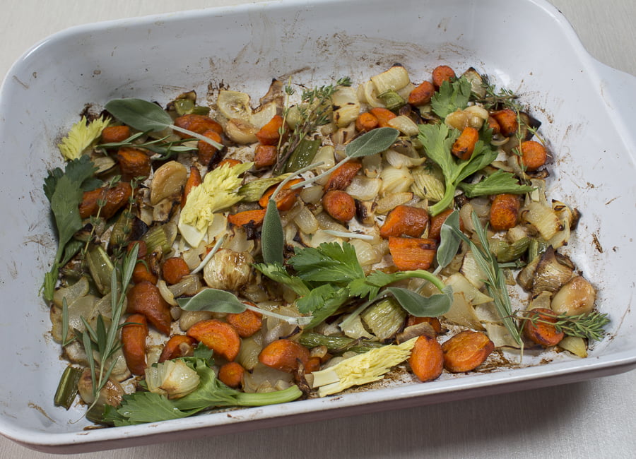 Caramelize the vegetables on the bottom to the pan with the turkey, than add herb sprigs. Credit: Karen Sheer