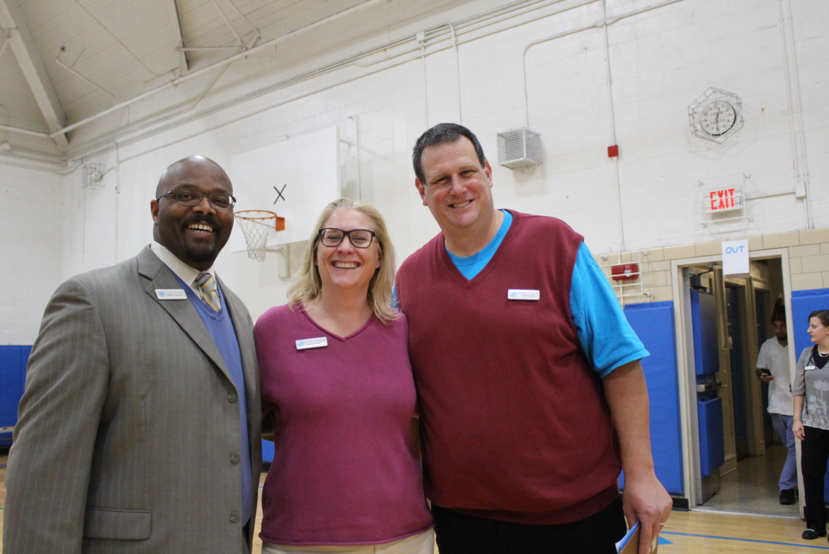 Bobby Walker, Megan Sweeney and Don Palmer at the Thanksgiving feast at the Boys and Girls Club of Greenwich. Credit: Leslie Yager