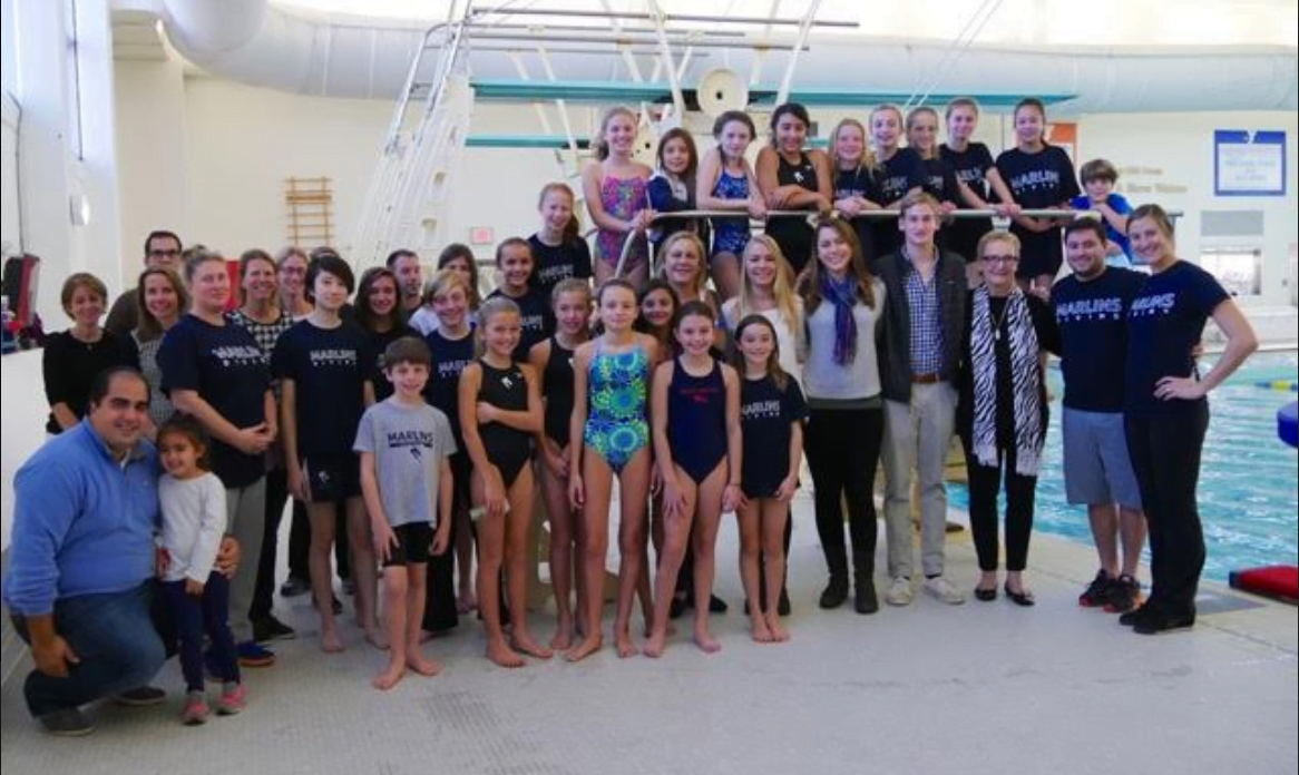 Powers family, YMCA Marlins Divers and coaches pose with the new 1-meter diving board