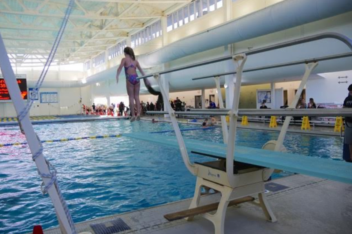 Diver participate in a flipathon to raise funds for the YMCA on the new 1-meter diving board. 