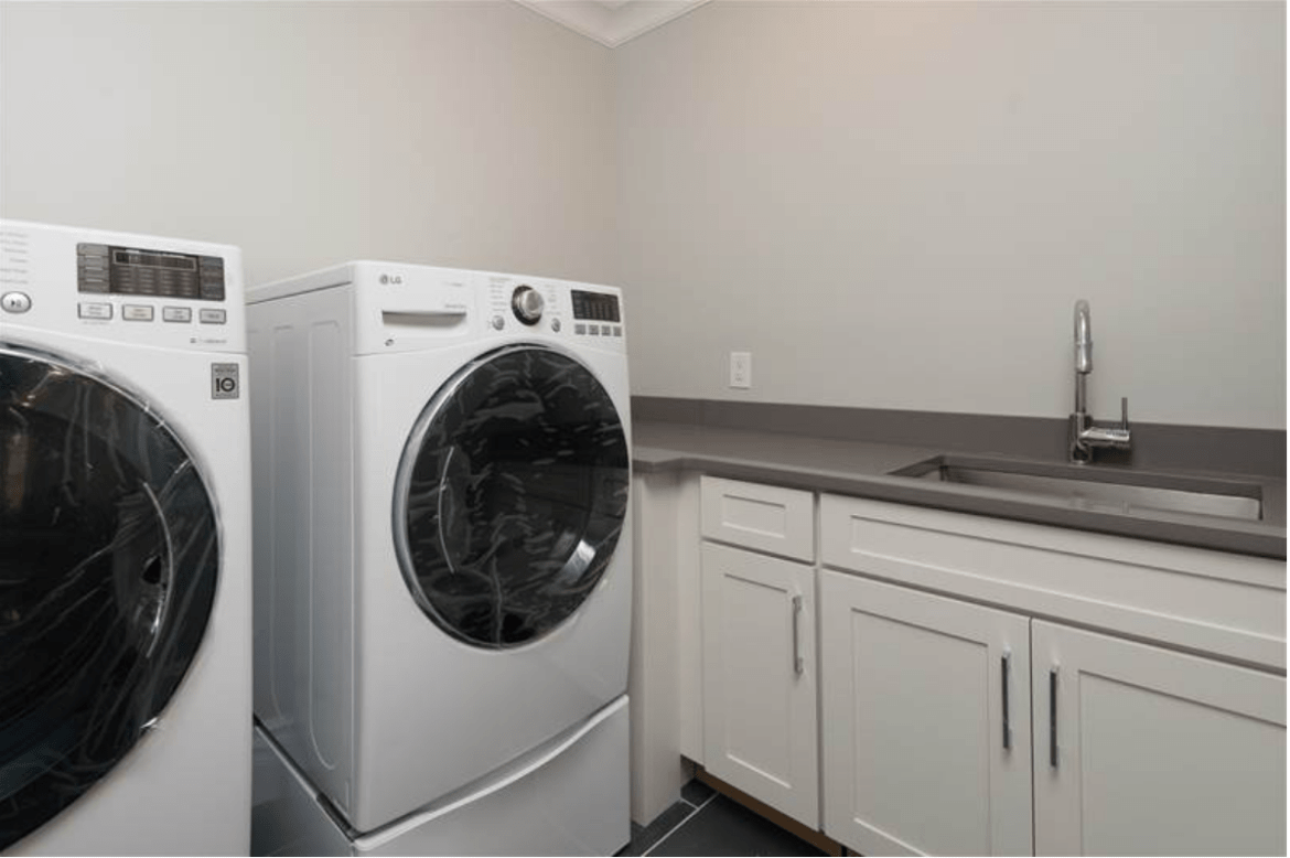 Separate Laundry Room: LG Washer and Dryer. Under-mount sink and cabinets