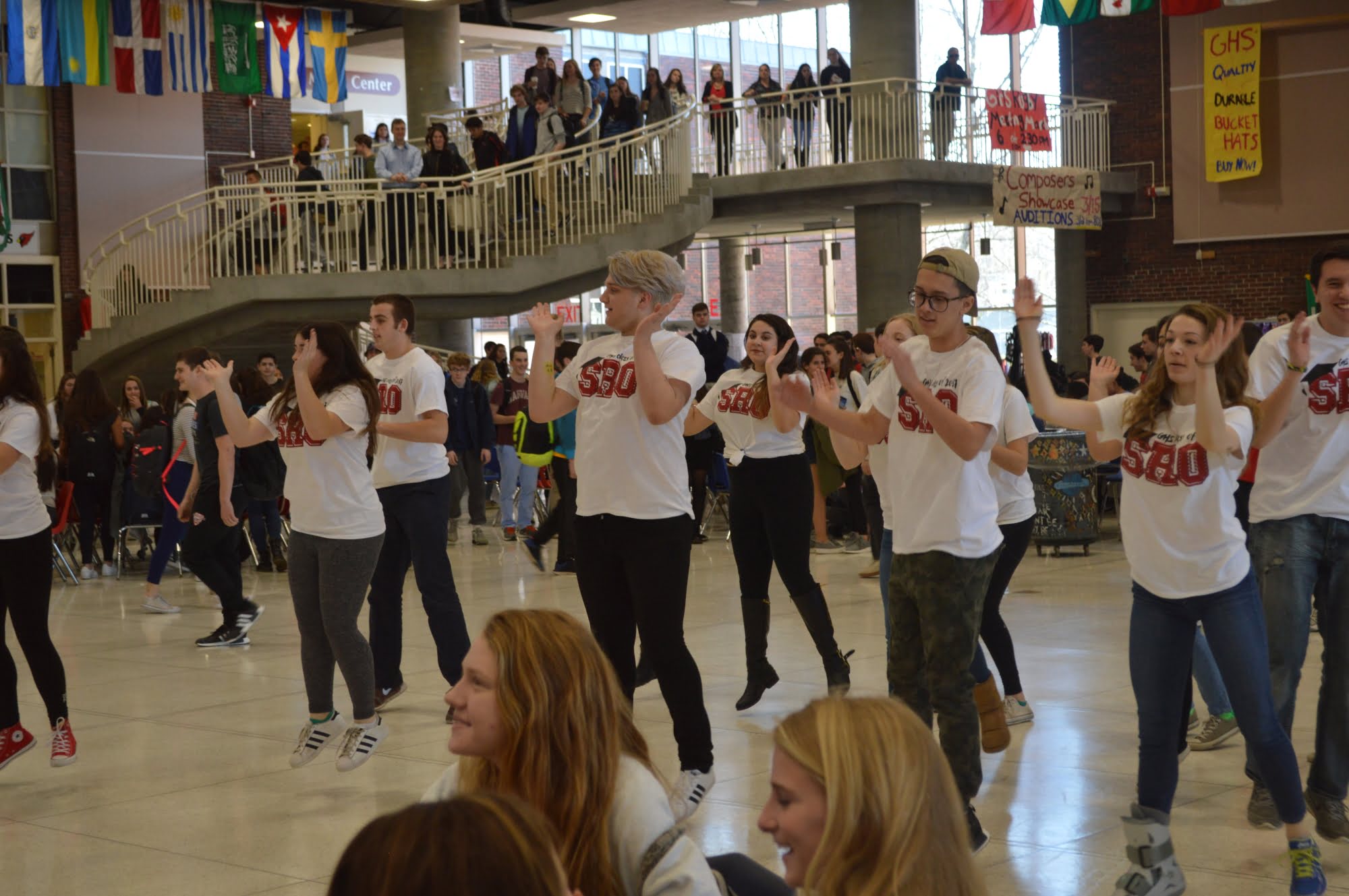 Seniors enjoy themselves during a flash mob in the student center to promote the show.
