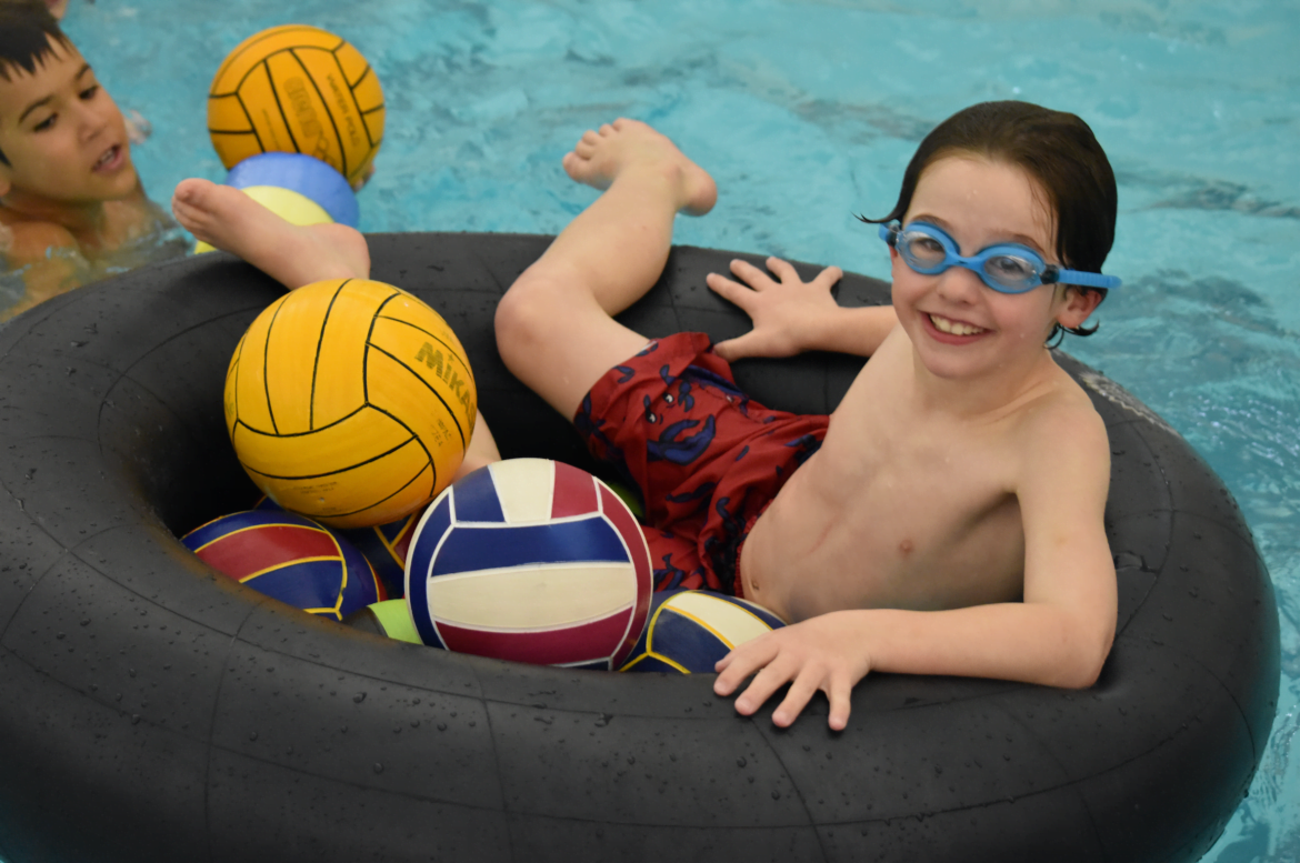 Murphy Bennett played inner-tube water polo at Scout Night at the YMCA “Scout Night” event in Greenwich. Photo Credit: Heather Brown