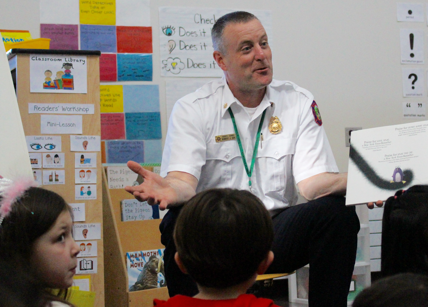 On Read Across America on March 2 at Hamilton Avenue School, Greenwich Fire Dept Assistant Chief Robert Kick took a break from reading to children to field a flurry of questions.