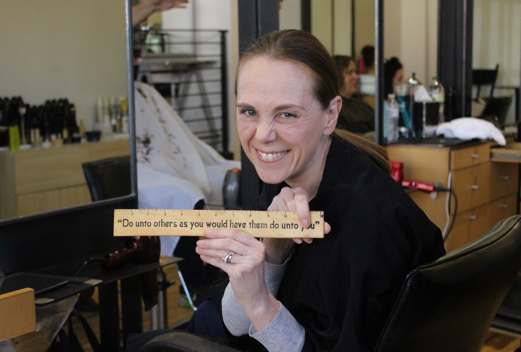 Jenny Byxbee with the Golden Rule ruler, which reminds everyone to “Do unto others as you would have them do unto you.” March 17, 2017 Photo: Leslie Yager