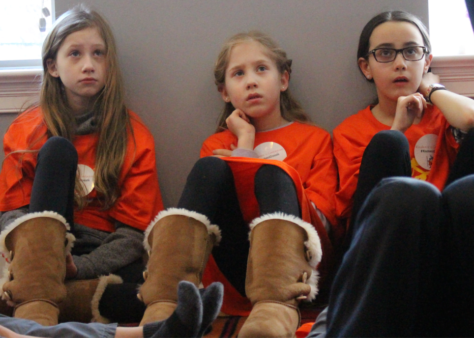 Emilie and Sophia Wasserman with Sophia Large listening intently to Orley Wahba's story. Photo: Leslie Yager